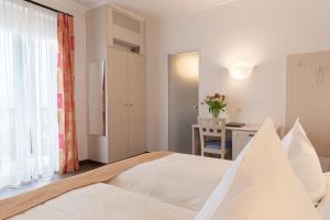 Posteľ alebo postele v izbe v ubytovaní Hotel Tobler