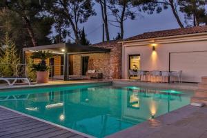 a swimming pool in front of a house at Villa d'exception au Beausset avec piscine chauffée in Le Beausset