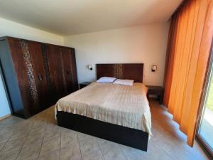 A bed or beds in a room at Private Villa 102 with heated pool in BlackSeaRama