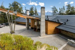 a house with a roof that is under construction at Calfuco Wine Hotel & Spa in Villa La Angostura