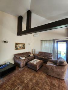 A seating area at Private Villa 102 with heated pool in BlackSeaRama