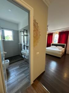 Postel nebo postele na pokoji v ubytování Hotel Tepelena