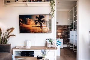 a living room with a tv on the wall at EdelStein in Stein