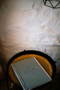 a book sitting on top of a table at Sea Side Studios & Houses in Kalo Livadi