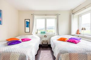 Postel nebo postele na pokoji v ubytování Magnifiques chambres d'hôtes au grand air