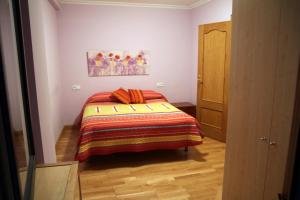 A bed or beds in a room at Apartamentos Gebala