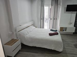 Giường trong phòng chung tại Apartamentos Sanlucar