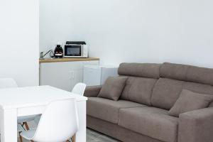 Khu vực ghế ngồi tại Apartamentos Sanlucar