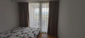Postel nebo postele na pokoji v ubytování OpenView Apartment