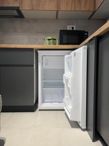 Kuchyň nebo kuchyňský kout v ubytování OpenView Apartment