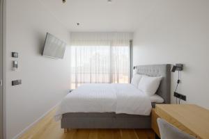 Postel nebo postele na pokoji v ubytování Esplanaadi Apartment with roof terrace