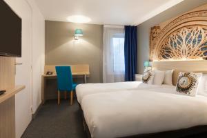 Postel nebo postele na pokoji v ubytování Brit Hotel Confort Amiens + 33 fotografií