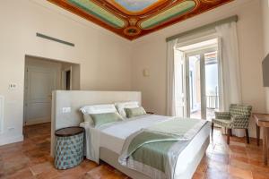 Postel nebo postele na pokoji v ubytování Aqua Mirabilis Relais de Charme