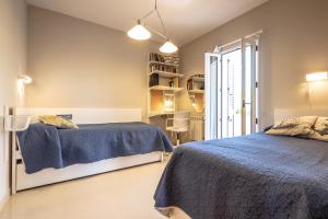Posteľ alebo postele v izbe v ubytovaní Casa junto al mar con jardín
