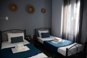 A bed or beds in a room at Batsi Bay Premium