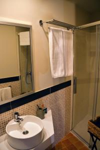 a bathroom with a sink and a shower at Casa Mari chelvas in San Asensio +21 photos
