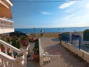 a staircase leading to a beach with the ocean at Vacation House Rental 20m From the Beach in Gerakini