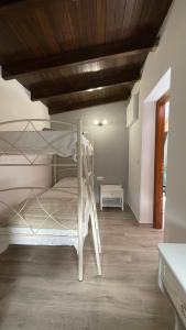 En eller flere senge i et værelse på Gesthimani's Residence