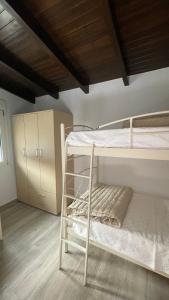 En eller flere senge i et værelse på Gesthimani's Residence