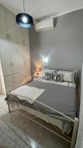 En eller flere senge i et værelse på Gesthimani's Residence