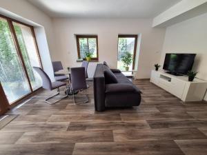 TV a/nebo společenská místnost v ubytování Apartmány Paseky - Jablonec nad Nisou