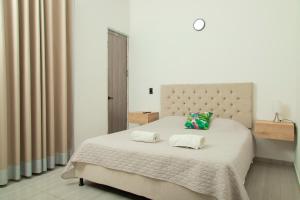 Postel nebo postele na pokoji v ubytování Casa del Lago