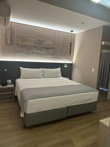 Ένα ή περισσότερα κρεβάτια σε δωμάτιο στο SAN MARINO SUITES HOTEL By NOBILE