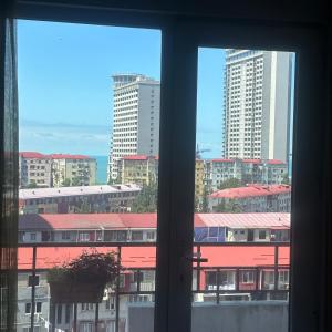 a view from a window of a city with buildings at Levanis in Batumi