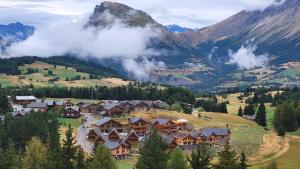 an aerial view of a resort in the mountains at Appartement 4 à 6 personnes - Chalets d'Aurouze - La Joue du Loup in Le Dévoluy
