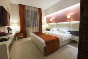 Postel nebo postele na pokoji v ubytování Airport Hotel Roomsity Pride