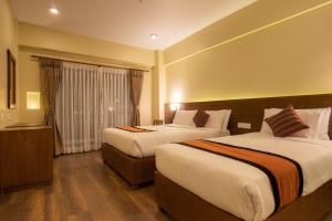 Postel nebo postele na pokoji v ubytování Airport Hotel Roomsity Pride
