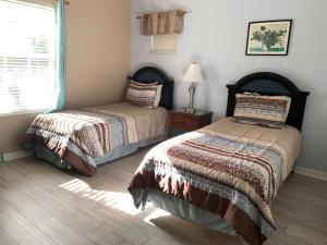 Ένα ή περισσότερα κρεβάτια σε δωμάτιο στο Bahama Bay- Two bedrooms condo fully equipped