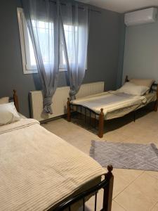 Postel nebo postele na pokoji v ubytování Filemial House