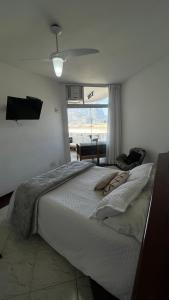 Cama o camas de una habitación en Vista para o mar Barra da tijuca