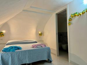 Ένα ή περισσότερα κρεβάτια σε δωμάτιο στο La Casa di Nina