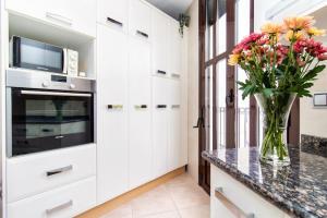 Køkken eller tekøkken på Mercantil - Apartments