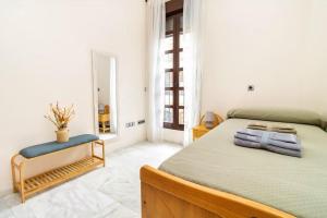 En eller flere senge i et værelse på Mercantil - Apartments