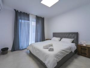 Postel nebo postele na pokoji v ubytování Center Luxury Rooms