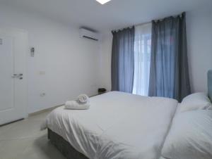 Postel nebo postele na pokoji v ubytování Center Luxury Rooms