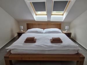Postel nebo postele na pokoji v ubytování Restaurace - Apartmány Bobule
