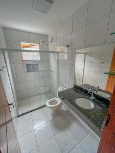 a bathroom with a toilet and a sink at Surf Stop Hostel Serra Grande in Uruçuca +42 photos