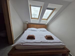 Postel nebo postele na pokoji v ubytování Restaurace - Apartmány Bobule