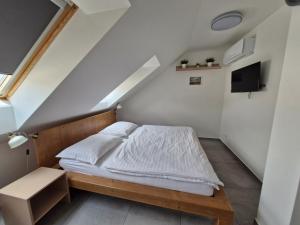 Postel nebo postele na pokoji v ubytování Restaurace - Apartmány Bobule