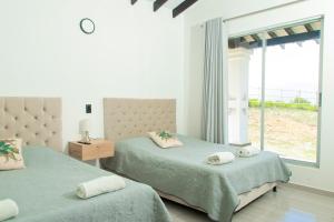 Postel nebo postele na pokoji v ubytování Casa del Lago