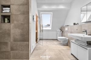 Koupelna v ubytování Ferienhaus Sonnenstein Fehmarn + 28 fotografií