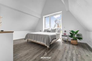 Postel nebo postele na pokoji v ubytování Ferienhaus Sonnenstein Fehmarn