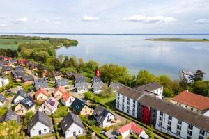 an aerial view of a town next to a lake at Strandhaus 1 EG in Marienfelde