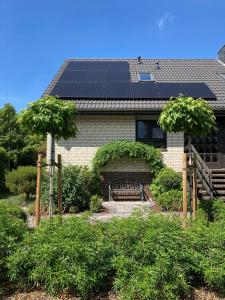 a house with solar panels on the roof at Schöne Aussicht - b45799 in Wienhausen