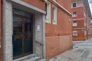 an entrance to a building with a glass door at OUH Candy Box in Bilbao