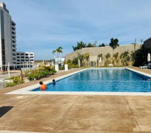 two children are playing in a swimming pool at Best option in Mazatlan in Mazatlán